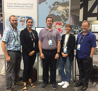 CIESIN staff in front of their exhibit booth at the 2018 Esri User Conference.